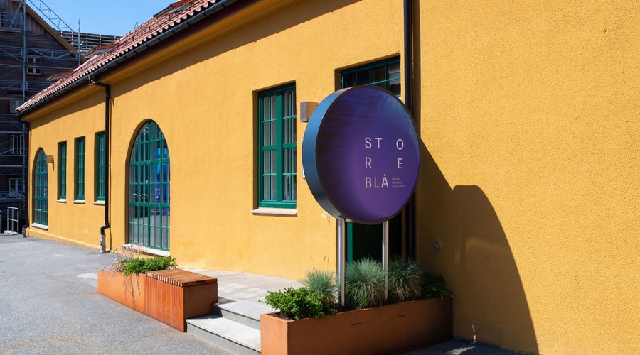 The exterior of Storeblå visitor centre, impossible to miss, as it is bright yellow. 