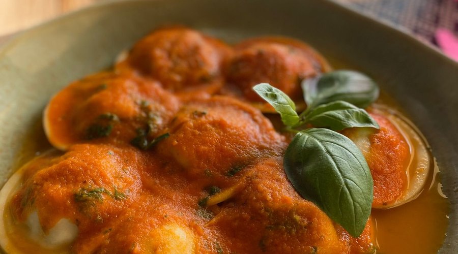 Cappellacci stuffed with aubergine, cougertte, potatoes and tomato basil sauce