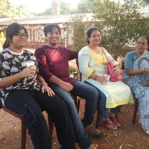 Welcome reception with lassi , flower and a clay bird
