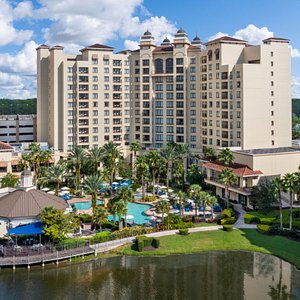 A 10-acre lake with fountains is surrounded by a walkway that connects the Wyndham Grand Orlando Resort Bonnet Creek with surrounding Club Wyndham resorts and their pool amenities.
