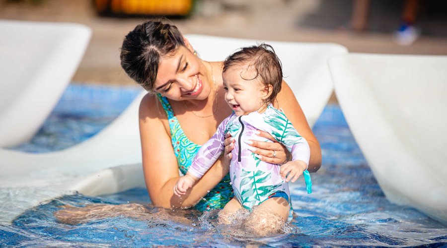 Mather and baby at family pool