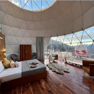 Step onto the private deck of the Luxury Dome and be prepared for an awe-inspiring experience. The vast, 360-degree panoramic view from this exclusive retreat is a canvas of nature's grandeur.

As far as the eye can see, the Himalayan landscape stretches out before you. Majestic snow-capped peaks rise in the distance, their timeless beauty inviting contemplation. Lush green valleys sprawl below, hinting at the richness of the flora and fauna that call this region home.