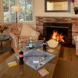 Family night in our spacious living rooms complete with wood-burning fireplace in our pet-friendly cottage suites.
