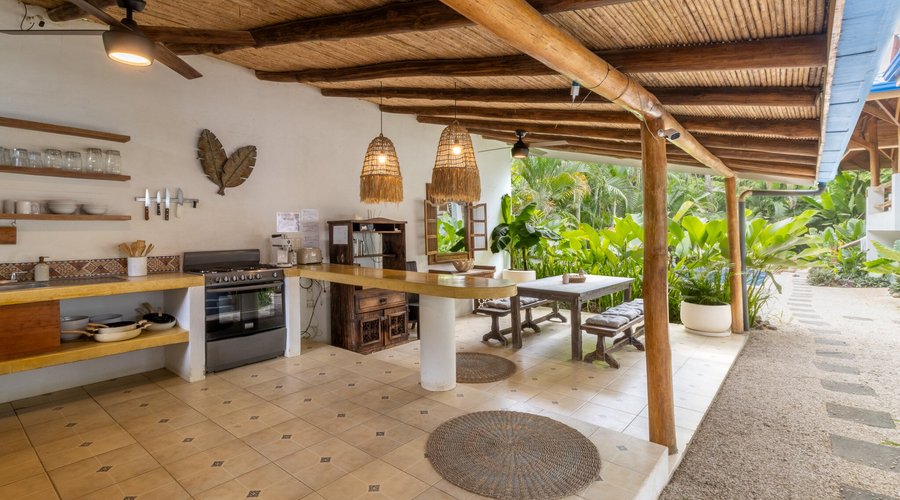 Dining and kitchen area during the day at Blue Surf Sanctuary 