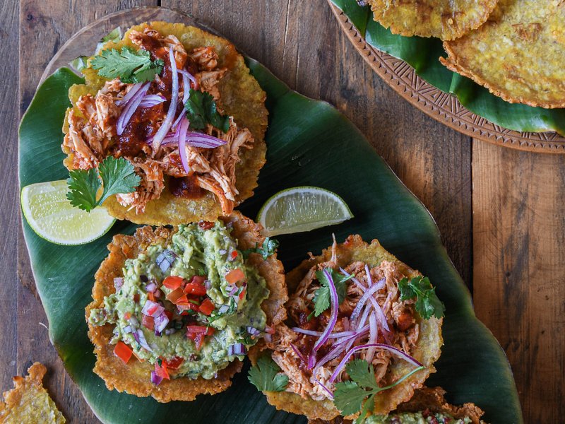 https://dynamic-media-cdn.tripadvisor.com/media/photo-o/2a/c6/1f/45/patacones-with-guacamole.jpg?w=800&h=600&s=1