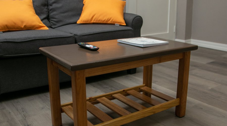 Sofa bed in living room area of the units that can accommodate three guest.