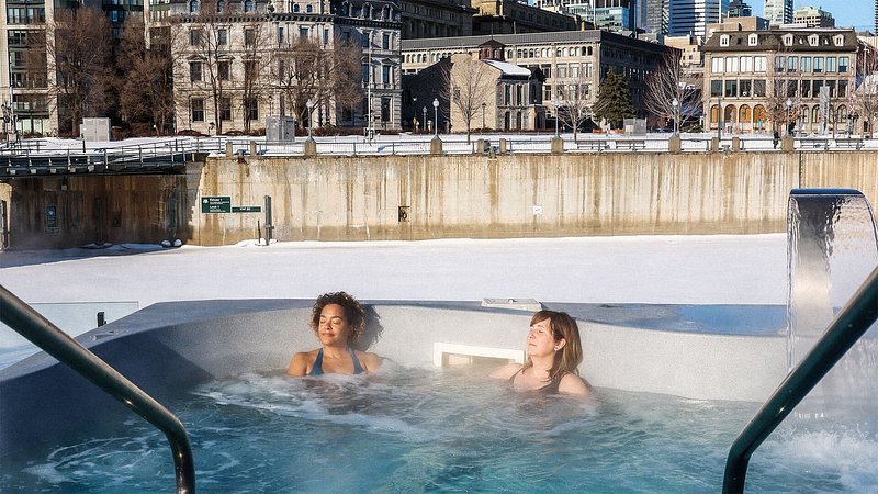 Two women relaxing in hot tub at Bota Bota Spa Sur’Leau