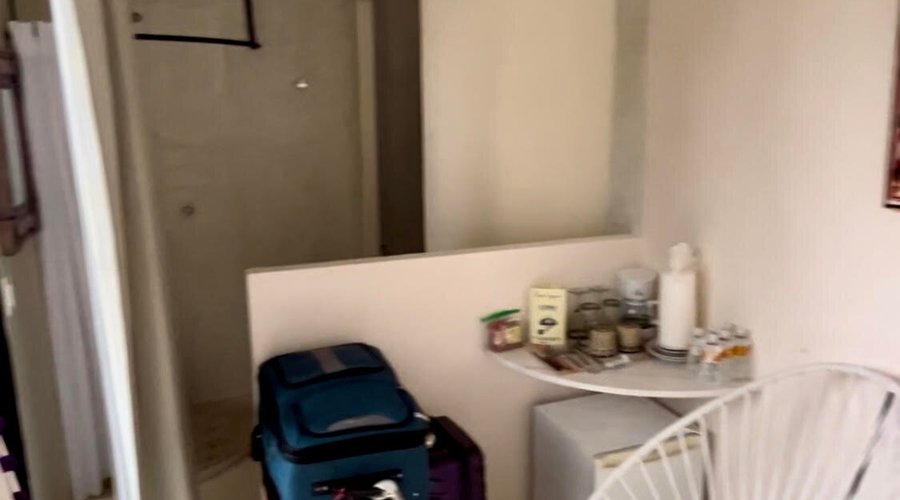 View of the inside of our room (toilet  back right corner)