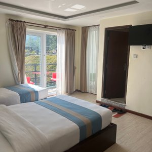 Double room with private balcony for viewing.