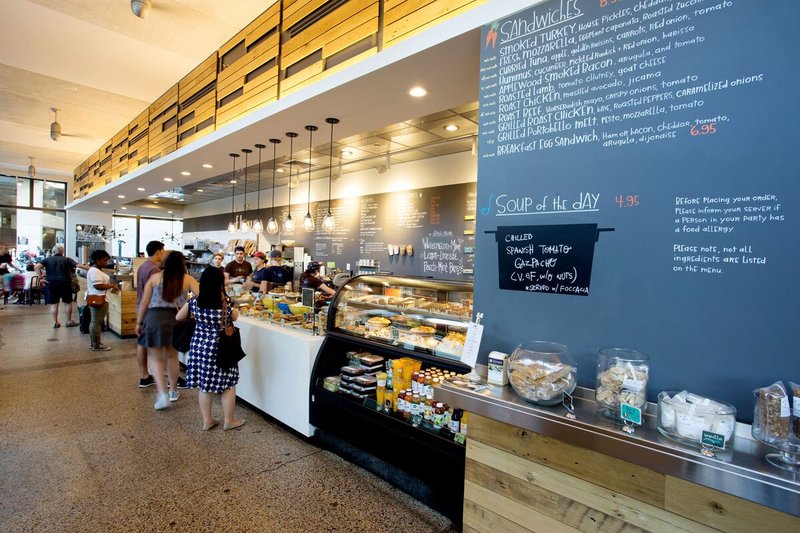 People lining up at bakery counter