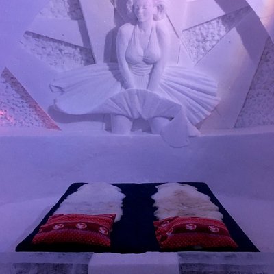 An intricate ice carving of Marilyn Monroe above a bed in Snowhotel Kirkenes, Norway.