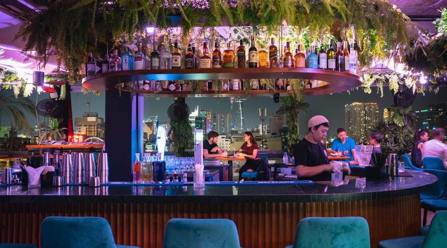 A spacious place, central round bar offering the view on the standing skyline of Saigon.
