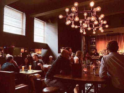 A group of people having drinks at Golden Age Cinema and Bar