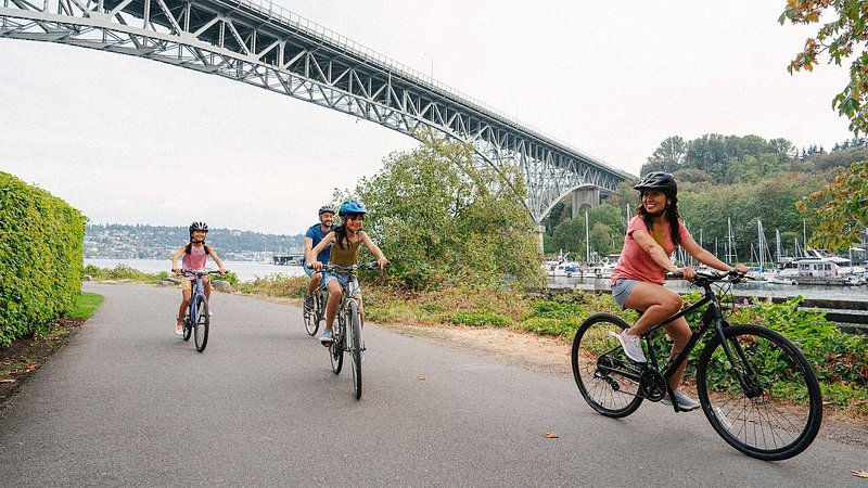 Family biking through Gas Works Park, in Seattle