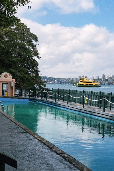 View of Maccallum Seawater Pool with the Sydney Ferry in the distance