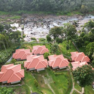 Nestled near Munnar, along the tranquil banks of the Muthirapuzha River, Riverdale Resorts offers a sanctuary inspired by the pristine beauty of nature. Enveloped by majestic high-range mountains, our resort emanates serenity, enhanced by the enchanting presence of two waterfalls and a refreshing climate. The renowned Muthirapuzha River, known for its crystal-clear waters and gentle ripples, gracefully meanders through the heart of Munnar
