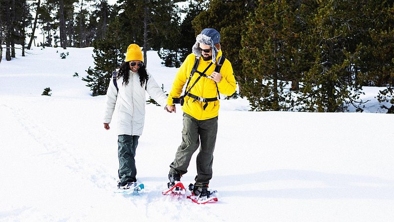 Couple snowshoeing in the winter