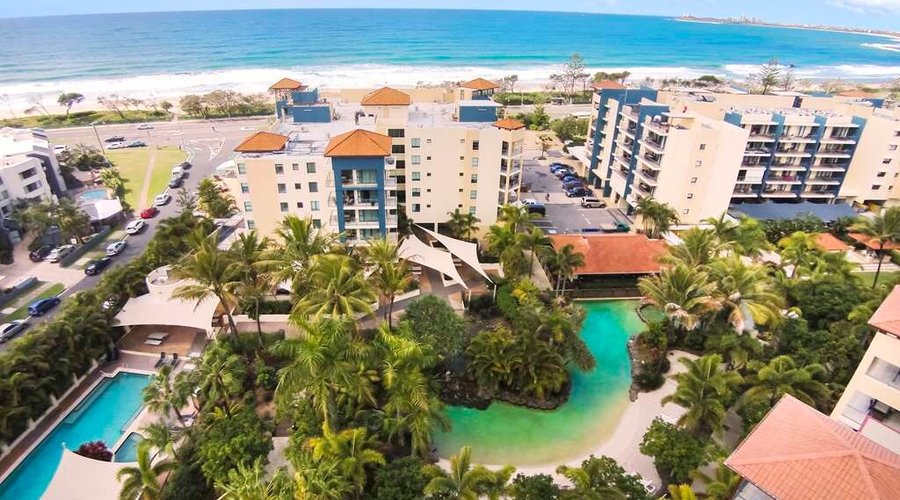 Aerial view of property and beachfront
