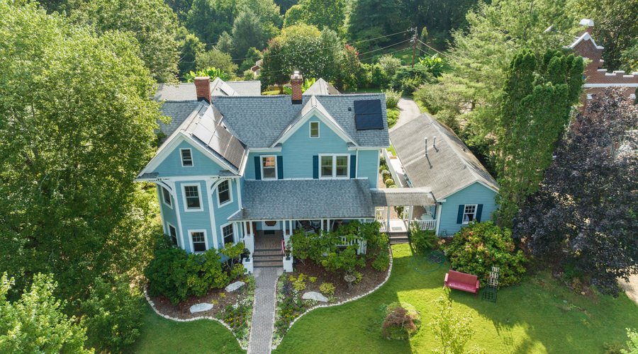 The Manor on Main is situated on a 3/4-acre picturesque lot boasting stately grounds with a beautiful herb and flower garden. The entire property consists of a large Victorian main house, a set of studio suites with a breezeway, and a free-standing cottage near the back gardens. The entire property comfortably sleeps 16 people. The 4-bedroom, 4 1/2-bath main house boasts a relaxing parlor, formal dining room, fully appointed cooks kitchen, expansive porches, private office, and so much more. 