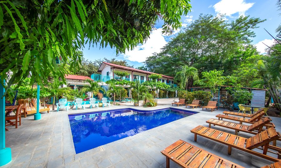 Tropical Fun Hotel feeling tropical.  So much green and blue to brighten anyones vacation. This shows our little hotel, pool, rancho with kitchen, reception and parking.