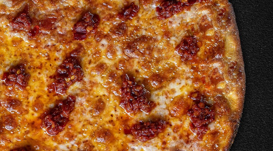 NDUJA  This pizza is perfect for those who think that Margherita is quite boring.   Passata di pomodoro italiano (Italian tomato purée) Mozzarella (Mozzarella cheese) Nduja Calabrese (Nduja from Calabria, Italy) E.V.O. Italiano (Italian extra virgin olive oil) 