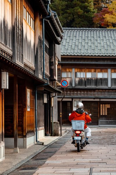 A motorcyclist in Kanazawa's Higashi Chaya District