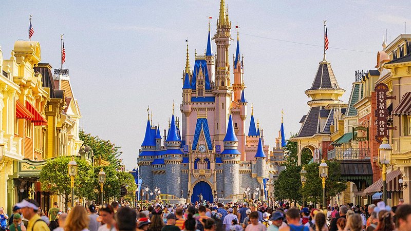 Tourists walking down Main Street U.S.A. with Cinderella Castle in the background at Disney World