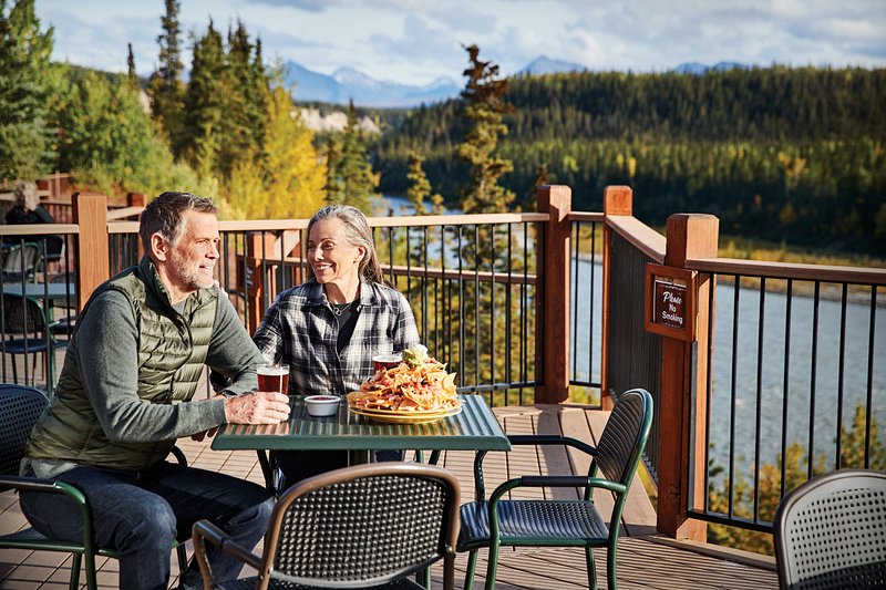 Couple dining on an outdoor patio in Alaska