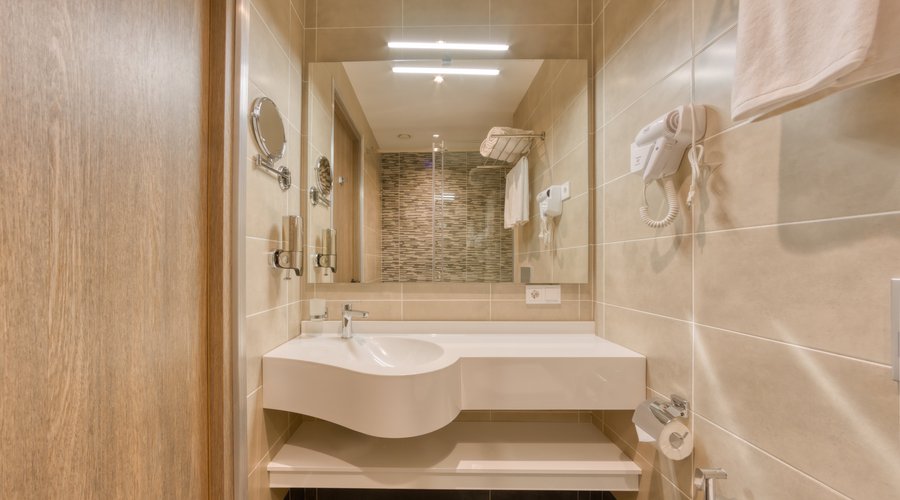 Standard Room/King/Twin The comfortable standard rooms have everything guests need: a comfortable bathroom, modern decor, cozy beds with high-quality mattress, WIFI, 43 inch Smart and interactive TV. Amenities and Facilities Complimentary teapot, tea, coffee and water, notepads, bathroom amenities, an iron and ironing board, Interactive TV, in room laptop size safe, hangers, a mini-bar (at an additional price), hygienic shower in all rooms. Interconnected room available Mansard rooms available