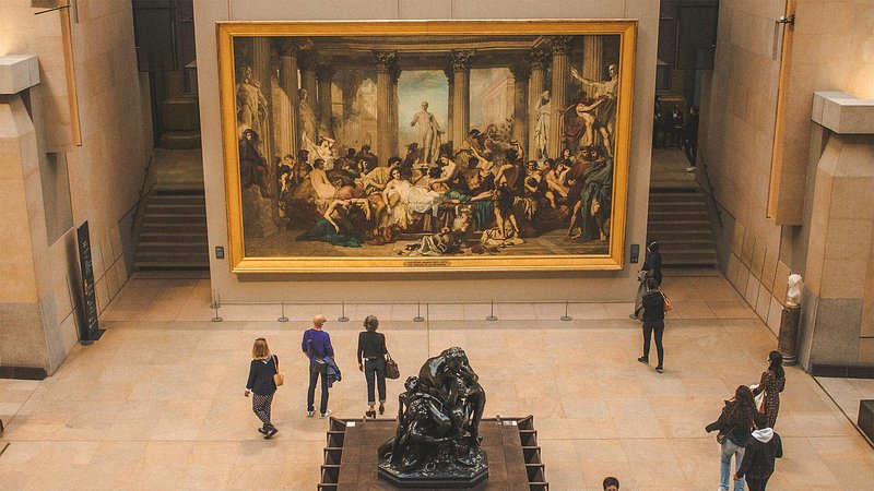 People viewing art at Museum d’Orsay, in Paris