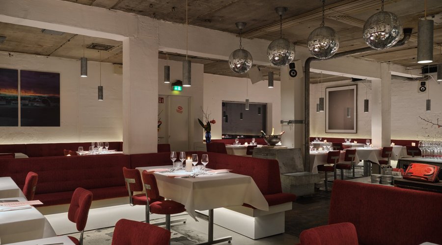 The Cookies Cream presents a harmonious blend of industrial chic and warm elegance, inviting guests into a space where modern design meets comfort. The striking contrast of exposed concrete and plush seating sets a sophisticated yet inviting tone. This unique atmosphere is perfectly suited for those seeking an elevated dining experience that balances the allure of fine dining with a relaxed, contemporary vibe.
