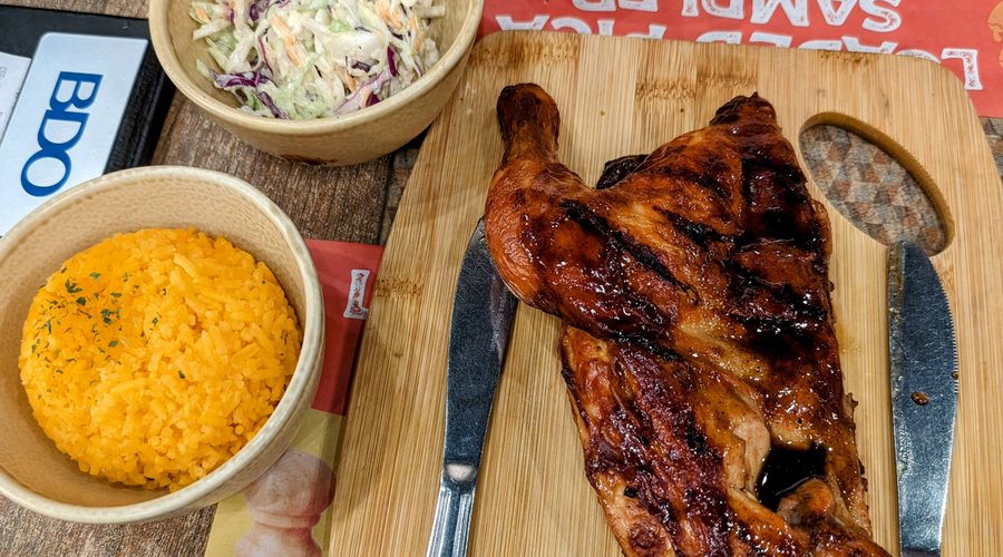 1/2 BBQ chicken with rice and coleslaw + corn with carrots.