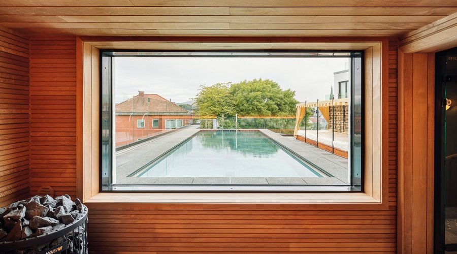 Rooftop pool and sauna area in summer