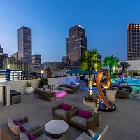 Relax at our rooftop pool deck with stunning city views