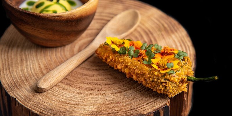 A small plate featuring a breaded pepper at Tresind