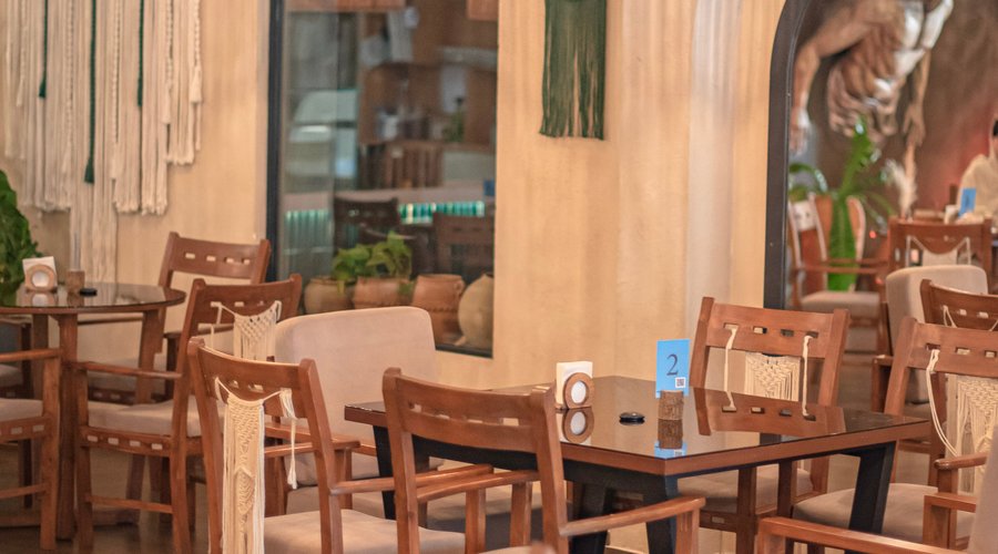 Immerse yourself in a vibrant dining experience at our restaurant, where indoor and outdoor seating blend seamlessly. Our welcoming staff ensures a warm atmosphere, offering a menu with delicious vegetarian options. Enjoy high-quality cuisine prepared with care and served promptly. An ideal spot for those seeking a delightful culinary journey.