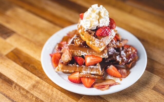 homemade waffle, strawberries, bacon, cream