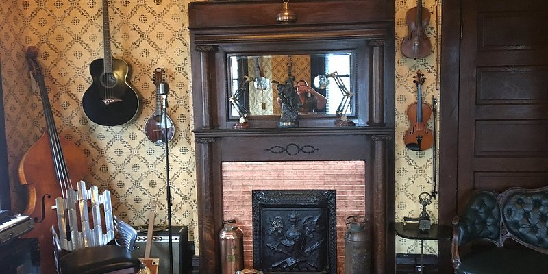 A parlor decorated with musical instruments at Urban Cowboy.