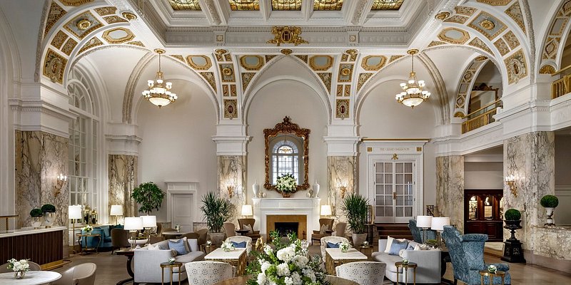 The gilded lobby space of The Hermitage Hotel with coffered ceilings.