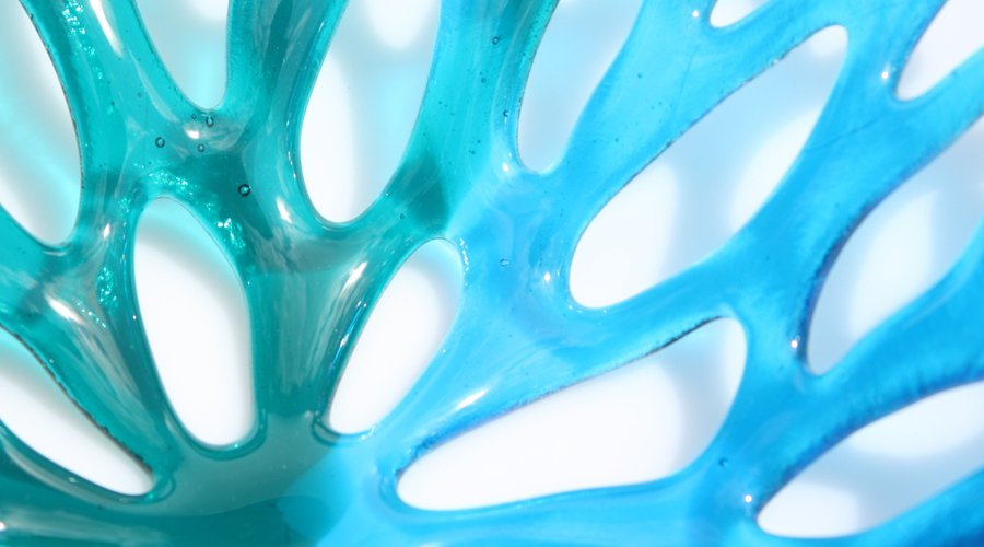 Detail of a blue Coral bowl in shades of blue transparent glass
