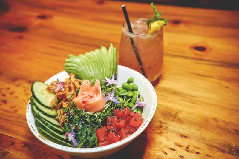 Poke bowl with cucumber, avocado, and edamame