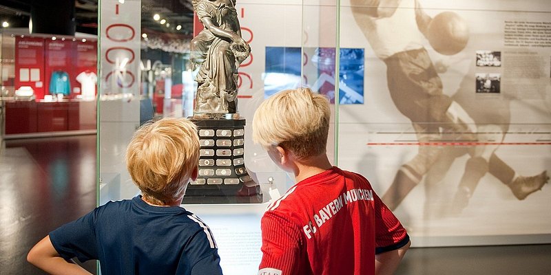 Visitors look at a display at FC Bayern Museum