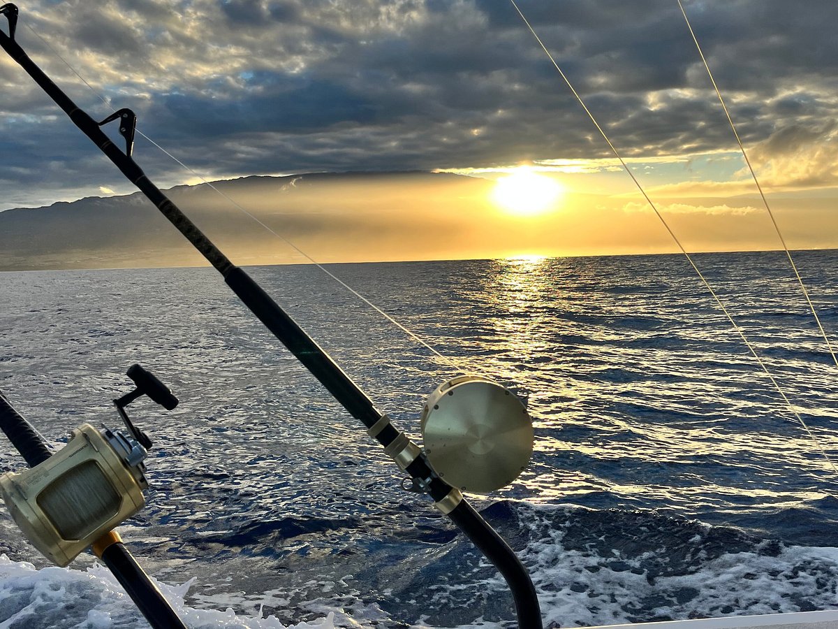 Premium Photo  Deep sea fishing reel on a boat during sunrise