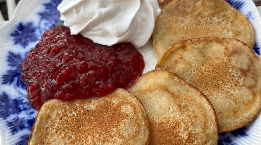 Banana pancakes with jam and whipped cream 