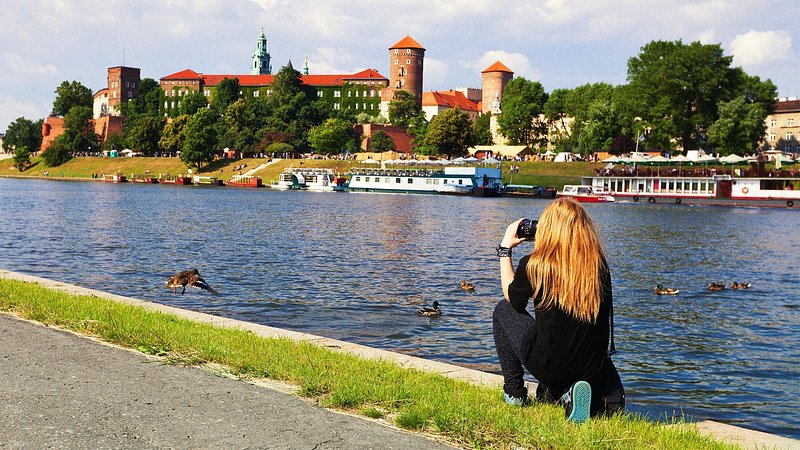 Tourist photographing Wawel Cathedral in Krakow