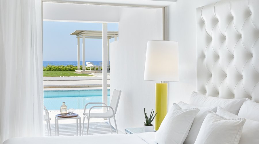 Step out of your room, onto your private terrace and into the refreshing waters of the resort’s sweeping shared pool. These bungalows, located in multiple wings of the hotel, have direct access to the outdoors and a view of the Aegean. Soothe your soul and relax in the summer breeze or slide your door shut to find privacy in an exquisite setting.