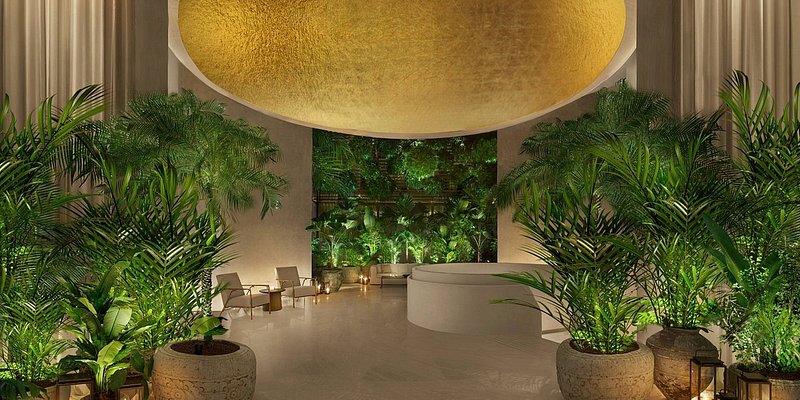 Lobby of the Singapore Edition surrounded by lush greenery, where the atmosphere is unique, enchanting and original