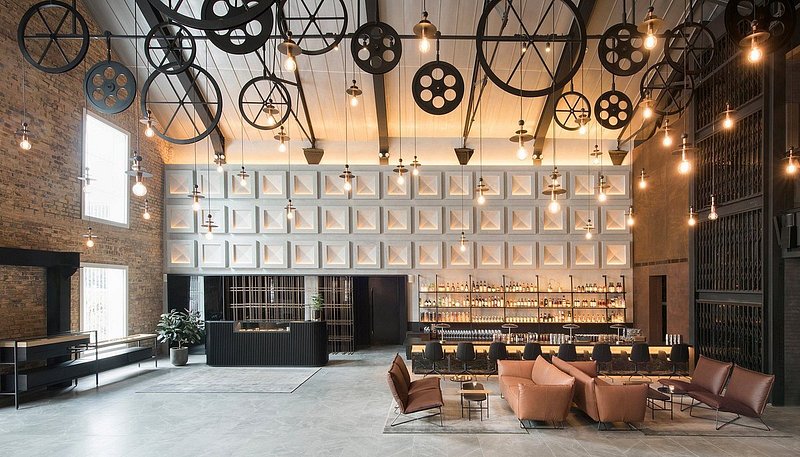 Lobby and bar area of The Warehouse Hotel appointed in a industrial chic design