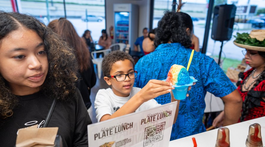 Hawaiian Luau at Sweet Aloha Ice Cream's 2nd Anniversary 3-Day Event and customer receiving his keiki rainbow shave ice!