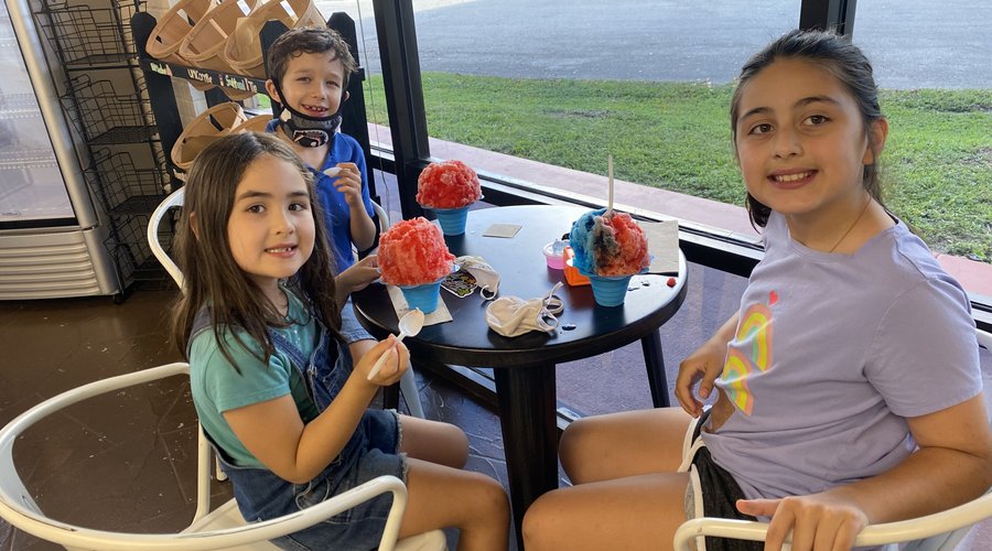 Customers enjoying their authentic Hawaiian shave ice from Sweet Aloha Ice Cream in Davie, Florida.